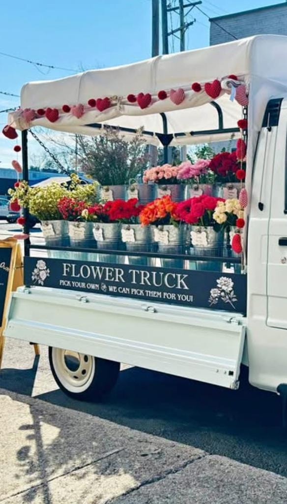 Vintage truck decorated with flowers and greenery